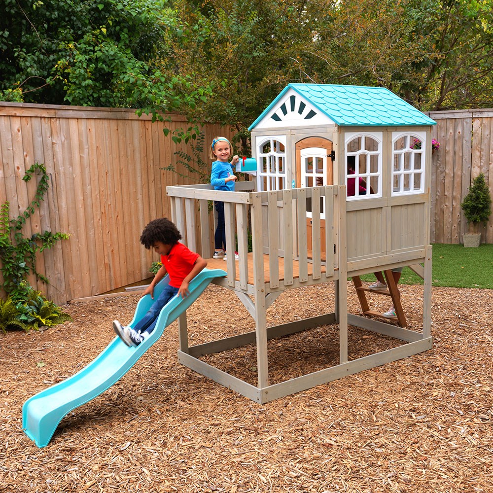 Wooden playhouse with slide