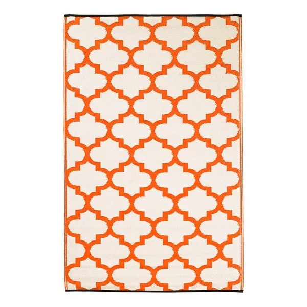 Reversible orange and white outdoor rug