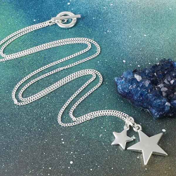 Long pendant necklace with star pendants