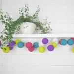 Colourful cotton ball lights in rainbow drops