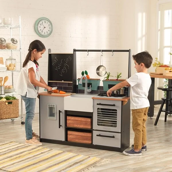 Girls and boys play kitchen set with pots and pans