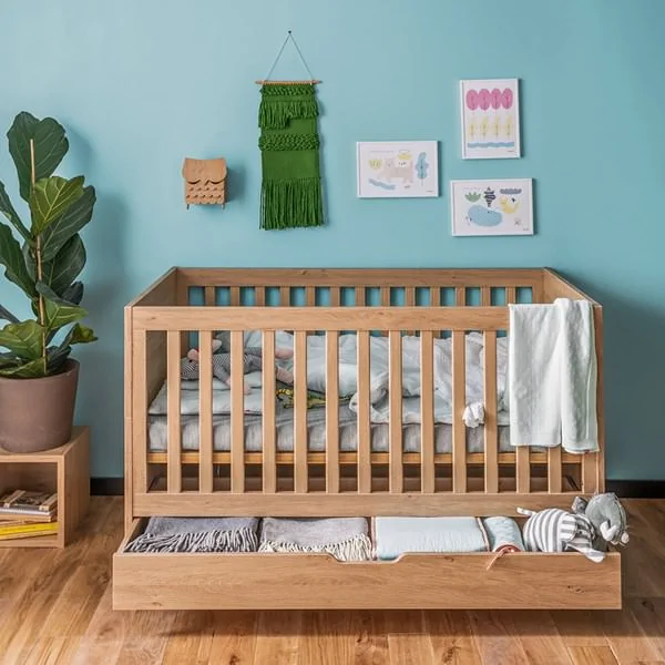 Scandi style cot bed with full length drawer