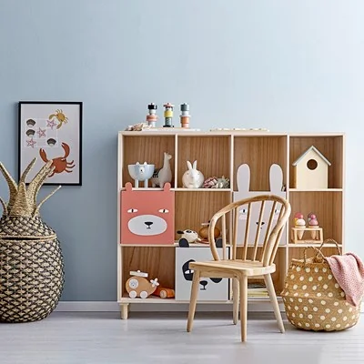 Bloomingville nursery bookcase with animal design drawers