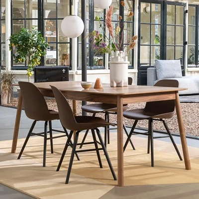 Glimps walnut dining table and albert kuip coffee chairs from zuiver