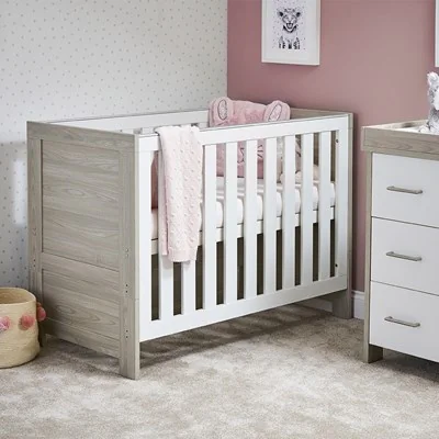 Grey wash and white cot bed with slatted sides