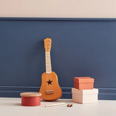 Kids concept toy guitar in yellow