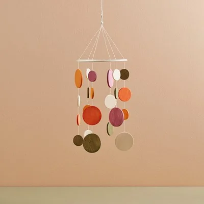 Scandi style wooden mobile in orange