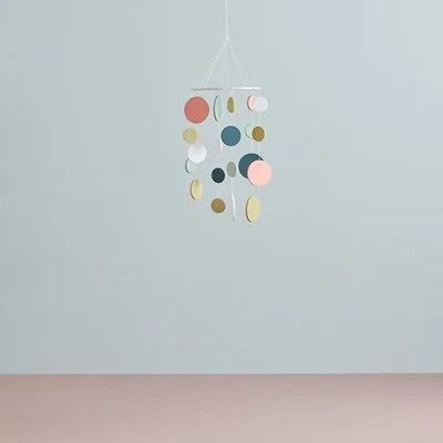 Wooden circular mobile in green and pink