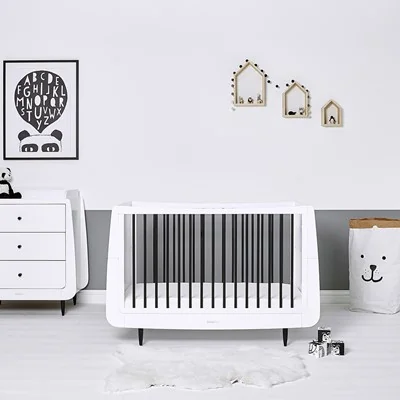 Wooden contemporary cot bed with black bars