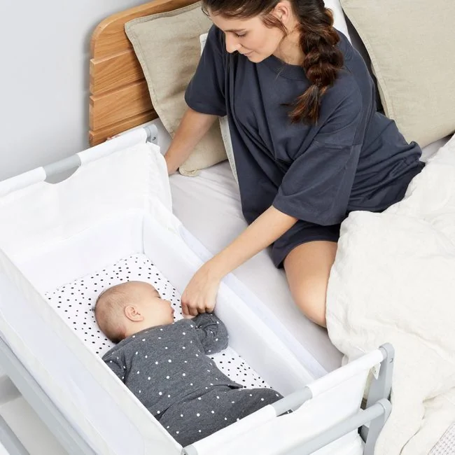 Snuzpod-4-Dove-Woman-With-Baby-in-Crib