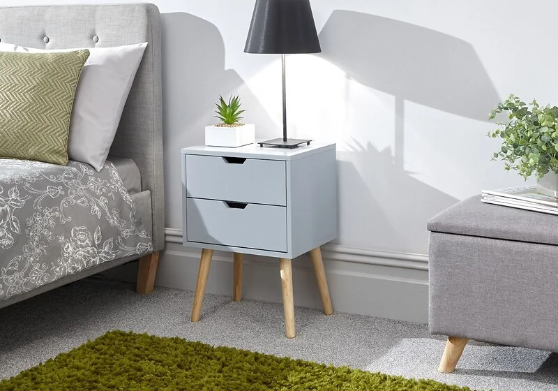 Nyborg 2 drawer bedside table with tapered pine legs and Scandi-inspired design.