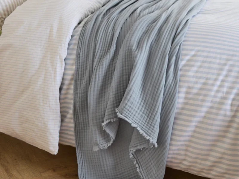 Crinkled cotton throw with frayed edge detail