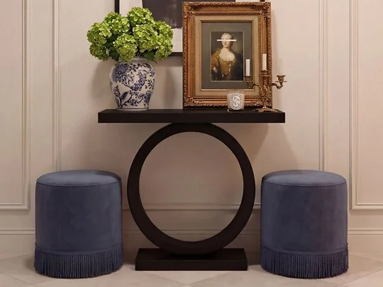 Small velvet pouffe used as a footstool
