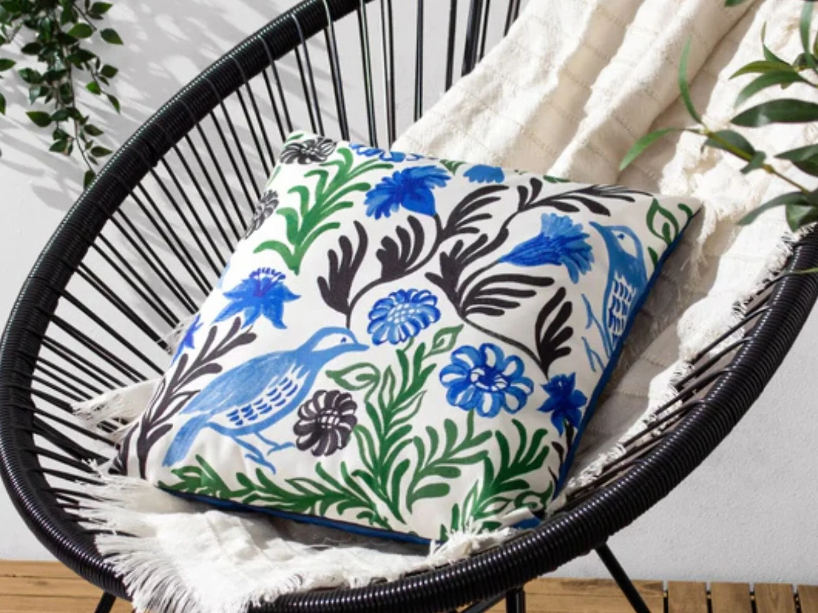 Furn Alentejo blue outdoor cushion with Mediterranean floral and bird design