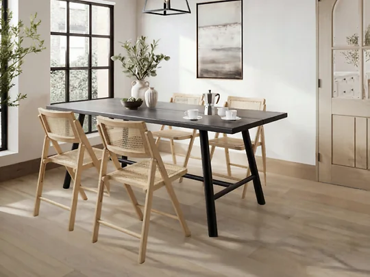 Modern black dining table set with foldable rattan chairs